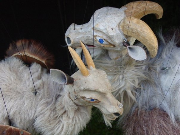 Image of two marionette goat puppets. 