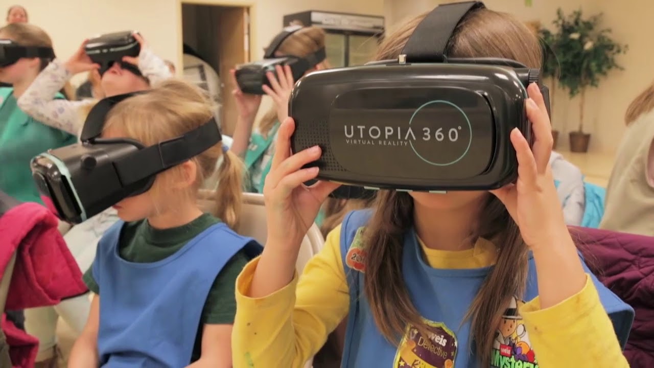 Image of Girl Scouts looking through Virtual Reality devices.