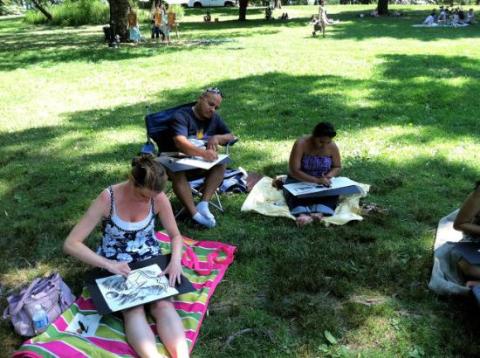 people drawing in the park