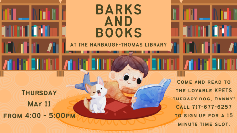 child reading to a dog in a library